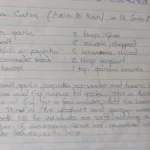 Handwritten banana curry recipe titled “Kela ki Kari à la Santa Maria” in a lined notebook.