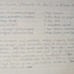 Handwritten mushroom curry recipe in a lined notebook